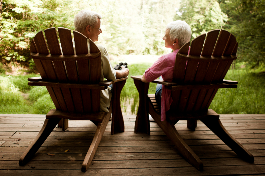 Senior Couple Lounging on a Wood Deck