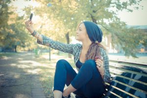 beautiful young blonde hipster woman selfie