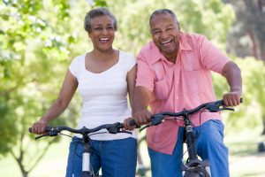 Senior couple on cycle ride in countryside