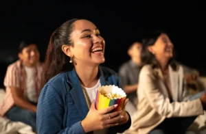 young lady with popcorn watching movie